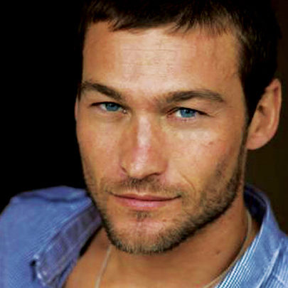 Headshot of Spartacus Star Andy Whitfield smiling gently at the camera.